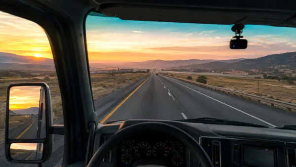 Semi-truck cab with a wordless dash cam monitoring the highway ahead